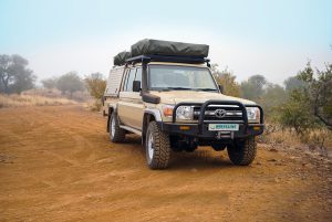 4wd vehicle parked in the outback, off road