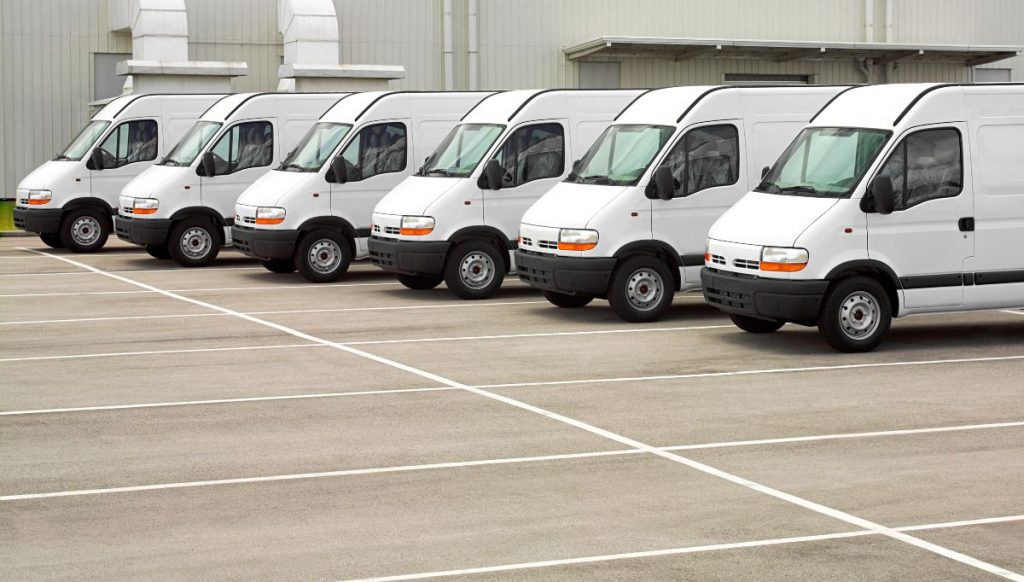 fleet of vans parked in a row