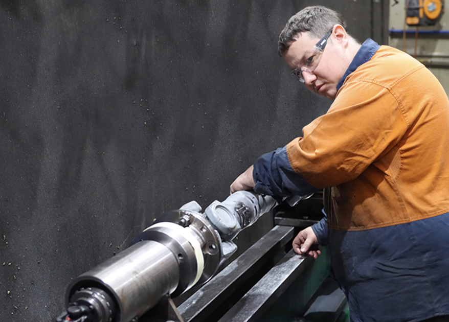 man repairing an underbody part