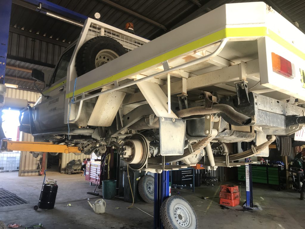 truck on a hoist in the workshop