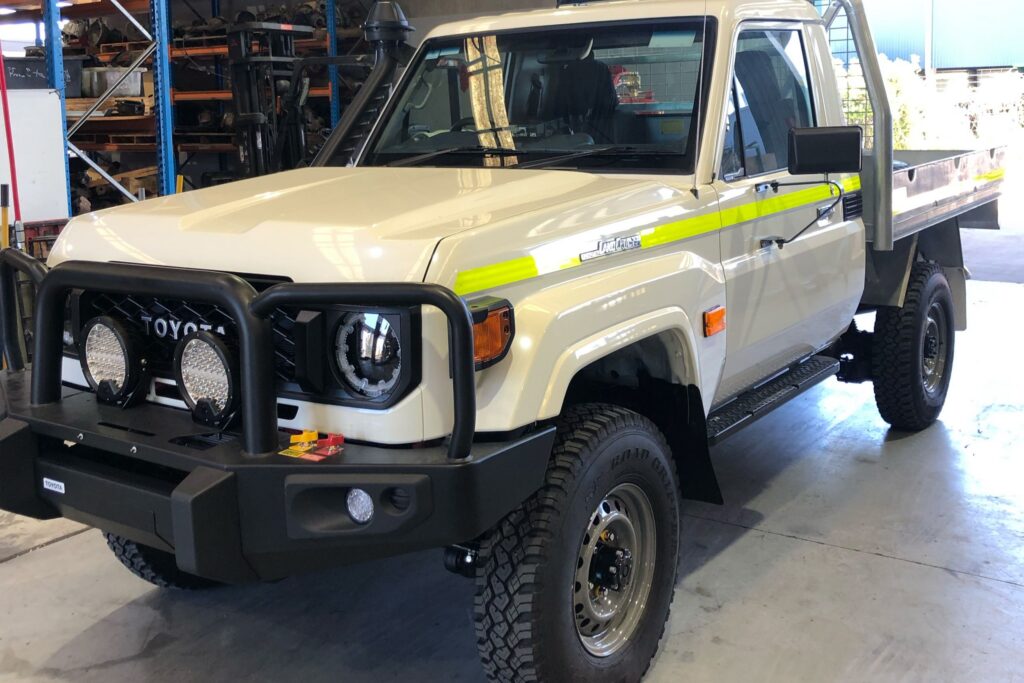 Fleet-spec Toyota LandCruiser 79 Series single cab with hi-vis striping, ready for commercial outback work