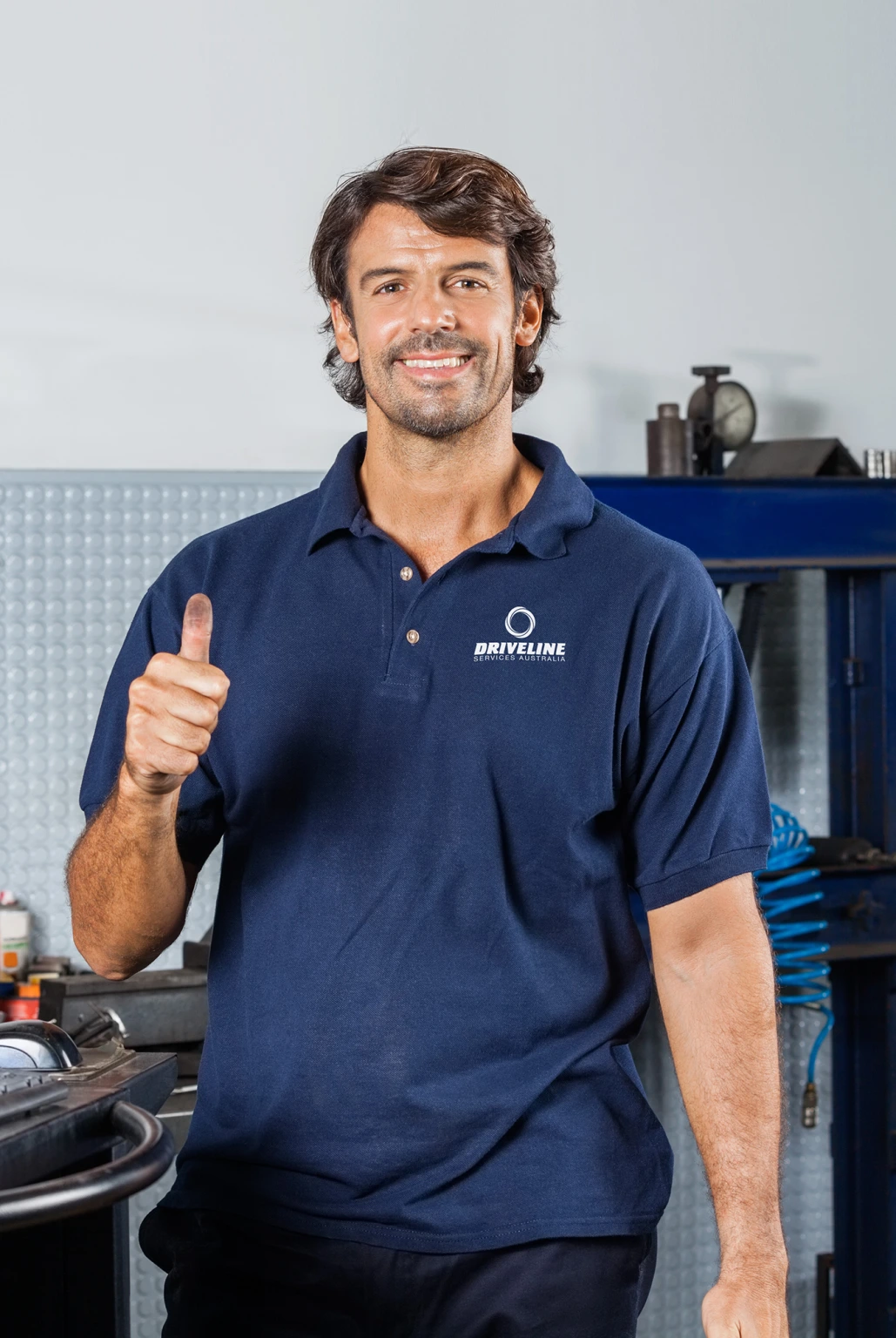 Driveline worker giving the thumbs up in the workshop